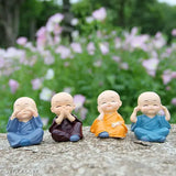 Multicolor Buddha Idol Decorative Showpiece Set (4 pcs) for car, home décor, or gift. Polyresin figures, ideal for shelves or showcases