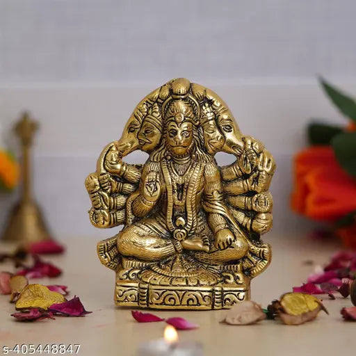 The image depicts a golden statue of Lord Hanuman