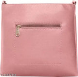 Pink leather sling bag with two straps and a zip closure