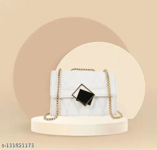 White sling bag with a quilted design and gold-tone accents