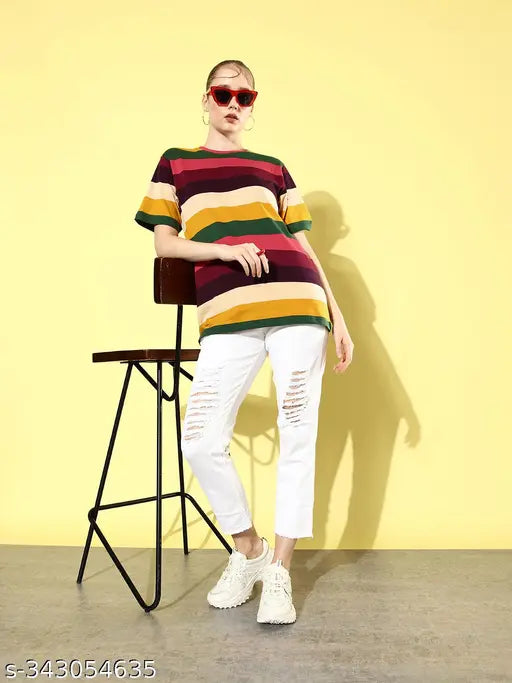 A woman wearing a striped, oversized t-shirt