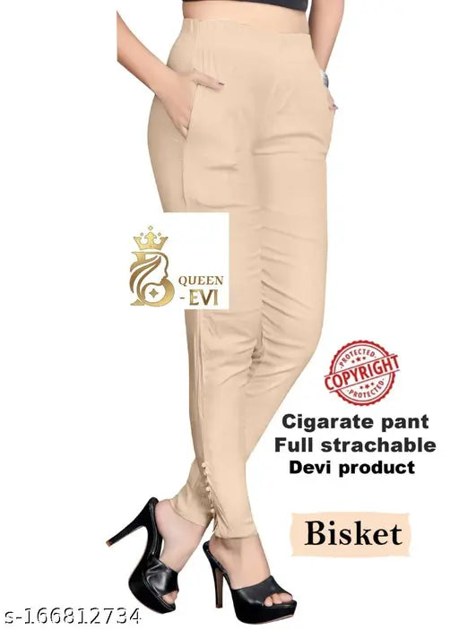 Brown high-waisted pants with pockets and black heels in advertisement