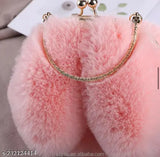 Furry handbag with long ear-like protrusions, perfect for casual outings, featuring a delicate closure. The bag is designed to complement the autumnal fashion trends and can be worn by women of all ages