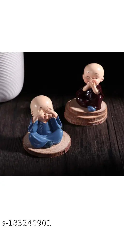 Multicolor handcrafted laughing baby monk Buddha statues (set of 4), 5cm polyresin figurines for home decor, car dashboards, or gift. Detailed artwork by skilled Indian artists