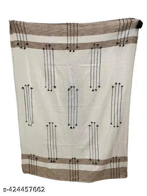 Ultra soft plush throw with intricate dobby design in shades of tan, beige, and dark brown, 100% cotton, hand-woven, export quality, great for a cozy living room, perfect as a gift