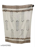 Ultra soft plush throw with intricate dobby design in shades of tan, beige, and dark brown, 100% cotton, hand-woven, export quality, great for a cozy living room, perfect as a gift