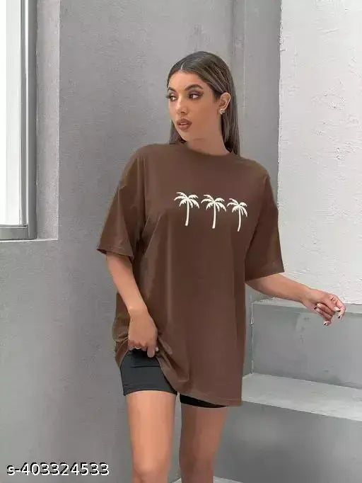 Woman in brown oversized t-shirt with palm trees graphic