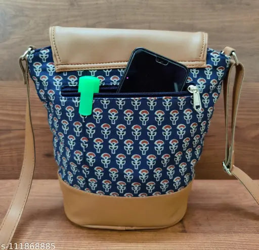 Blue and white crossbody sling with phone pocket, key hook, and adjustable strap