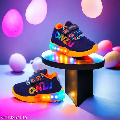 Vibrant blue and orange kid's sneakers with Velcro straps, LED lights on sole, pastel colors