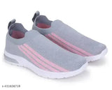 Gray and pink sneakers with white sole
