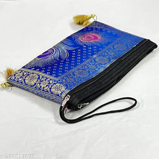 Blue embroidered clutch with tassels, likely made of a lightweight fabric