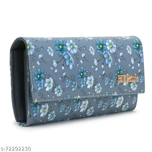 Grey clutch with blue flower pattern and small gold zipper