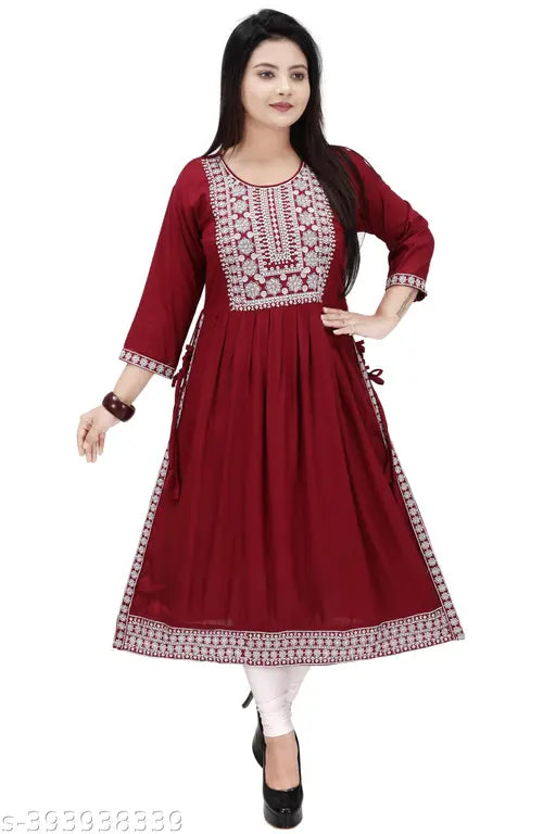 Rayon, 100% soft cotton blend kurta for beautiful women. Solid, round-neck, three-quarter sleeves, side slits, knee length. Great gift option for any occasion. Hand wash or machine wash. Crafted in India