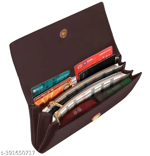 A brown leather clutch with a buckle closure