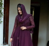 Elegant georgette gown, embroidered in floral patterns, paired with dupatta. Indian bridal wear on mannequin