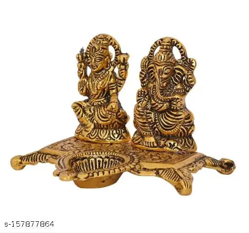 Metal PAYSTORE LAUXMI Ganesh idol showpiece oil lamp, Indian religious artifact on display