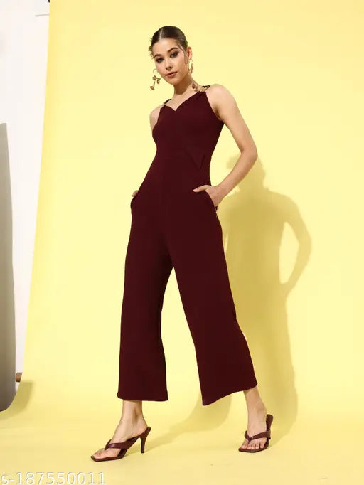 Maroon polyester v-neck jumpsuit by Miss Chase, sleeveless with metallic buckle detail and asymmetrical flap, size XS-XL (31in/54in-39in/58in)