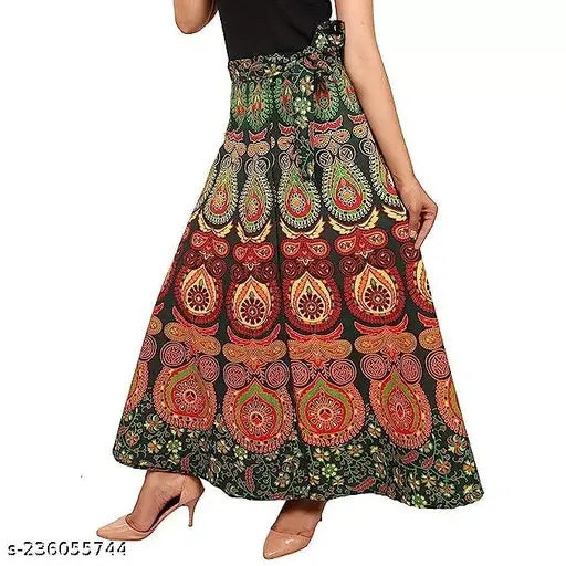 Long cotton skirt with a colorful print, flared style, and free size. The skirt is a maxi length and wraps around the body