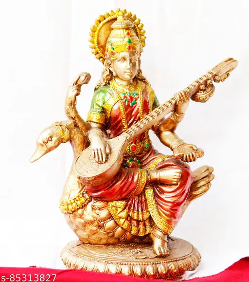 Golden handcrafted Goddess Saraswati with sitar statue, intricate jewelry and detailed attire