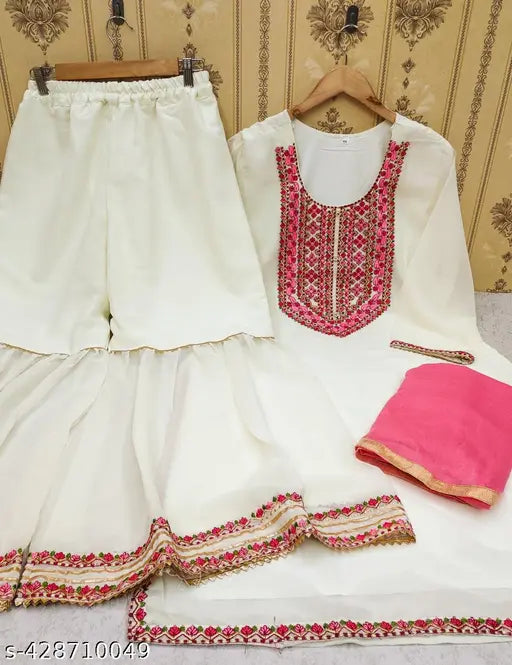 White silk blouse with red trim, pink dupatta