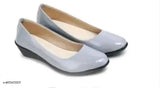 Grey, white, ballet flat shoe with a black toe box