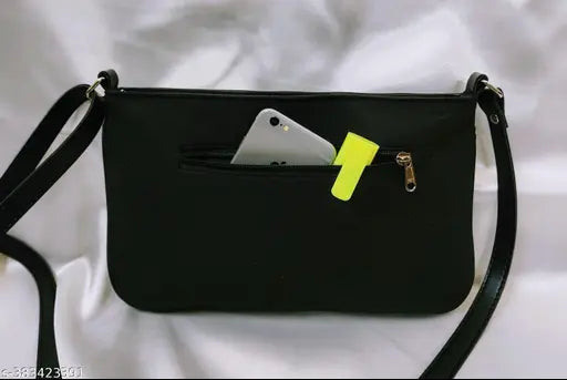 Black leather sling with phone card holder, silver buckle closure