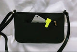 Black leather sling with phone card holder, silver buckle closure
