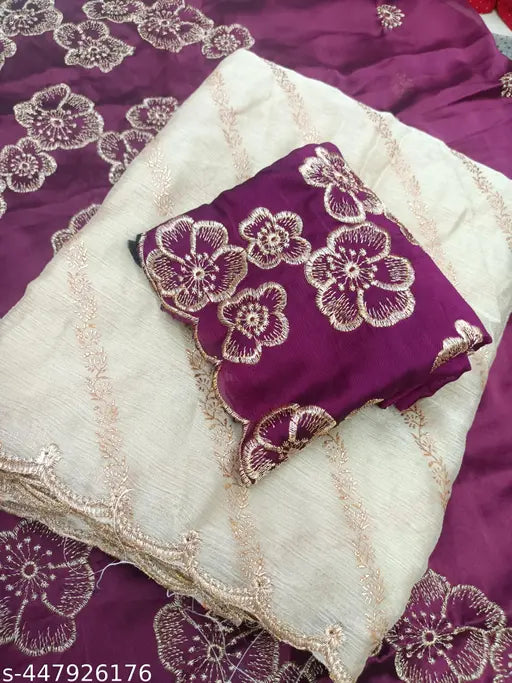 Maroon silk designer sari with floral border, fully draped and lying flat