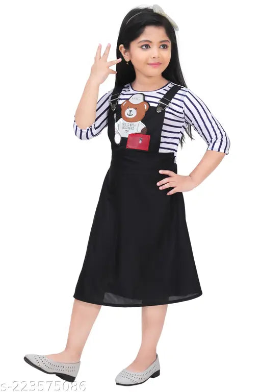 Knee length girls' dress in black with white stripes and blue cardigan