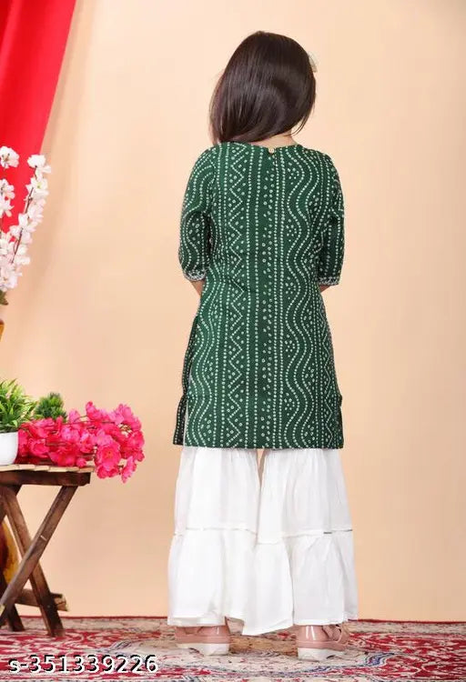Girls printed rayon kurta and sharara set, A-line top with three-quarter sleeves for sizes 5-12 years old, Indian traditional outfit on display
