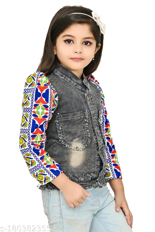 Young girl in denim vest with embroidered patterns, wearing makeup and black top