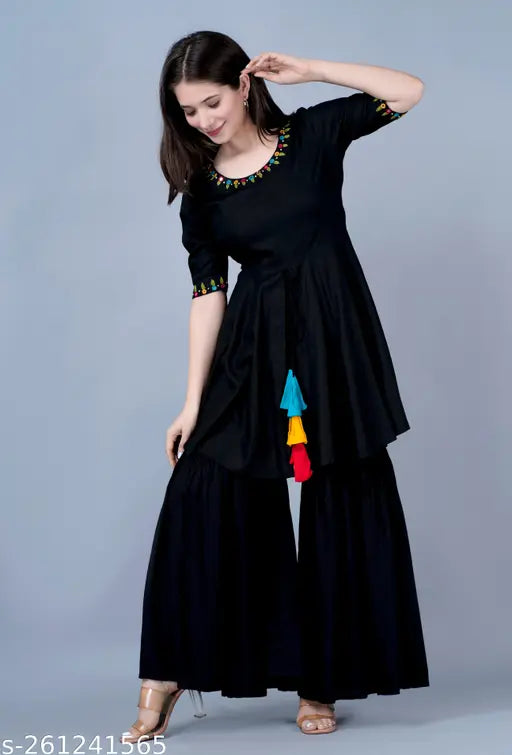 Black kurta set with mirrored embellishments, long flared trousers