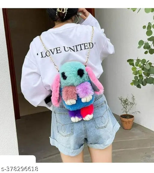 Furry sling bag with bunny ears, blue and pink faux fur, black strap