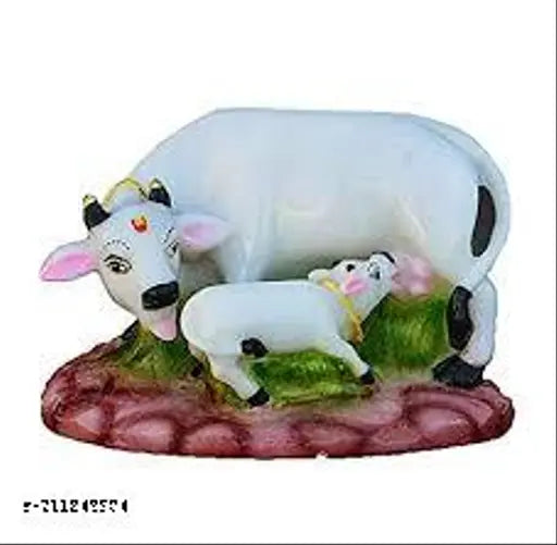 Handcrafted, poly resin mother cow & calf figurine with red and green clothing and stone accents. Multicolored, ideal for home temple or showpiece shelf. By JMK Enterprises. Made in India