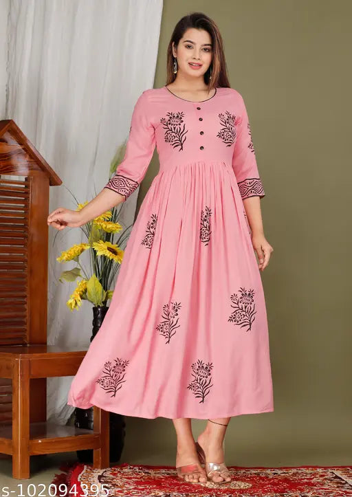 Stylish rayon kurti with hand-block printed design, three-quarter sleeves for women's wedding wear. Rayon Indian-made gown on hanger