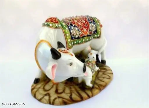 Handcrafted marble Kamdhenu cow and calf statue with diamond studs, spiritual Vastu decor for home or gift" (106 characters)