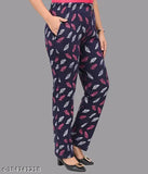 Black cotton track pants with leaf print