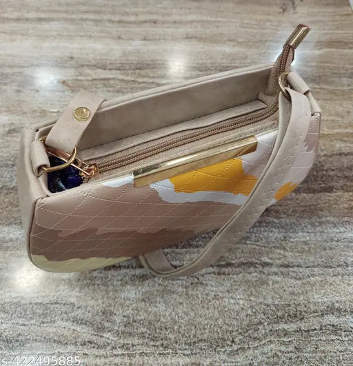 Tan faux snake skin slingbag with tan handle, metallic zipper, and coin purse inside