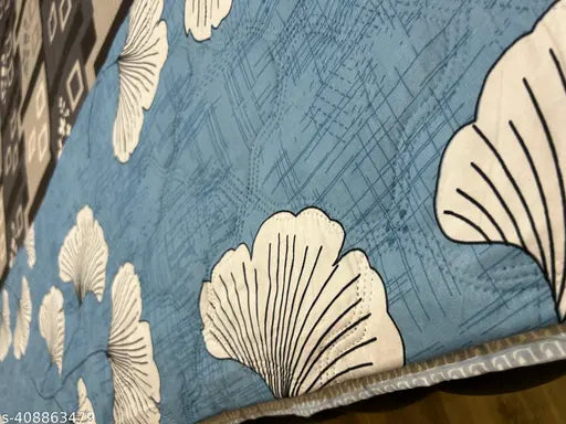 Black and white quilt with abstract leaf pattern