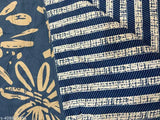Blue and white quilt with a floral design