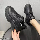 Black synthetic sneaker by Faiter, lace-up design with net detail, size 5