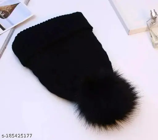 Black pompom beanie with fleece lining for women, available in assorted colors