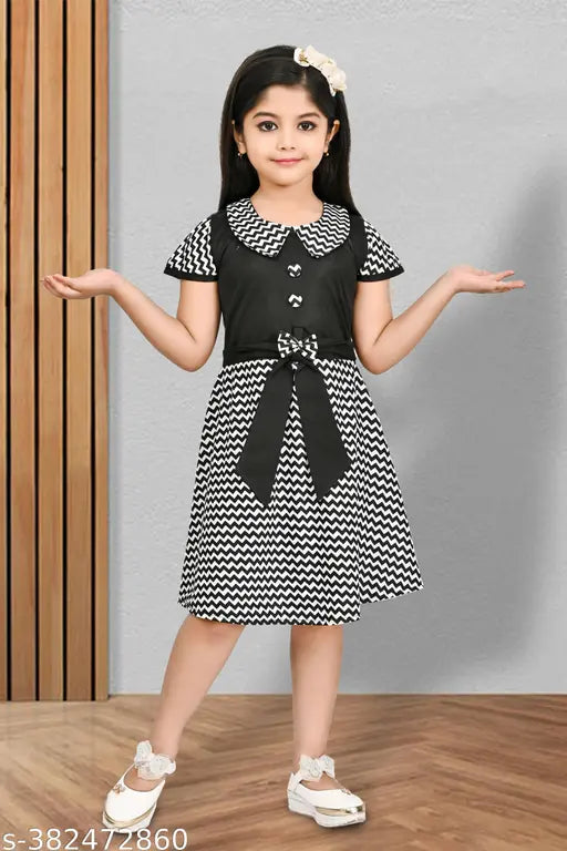 Black and white cotton party dress, girls size 6-12 years, long sleeves, embroidered waist accent, festive design