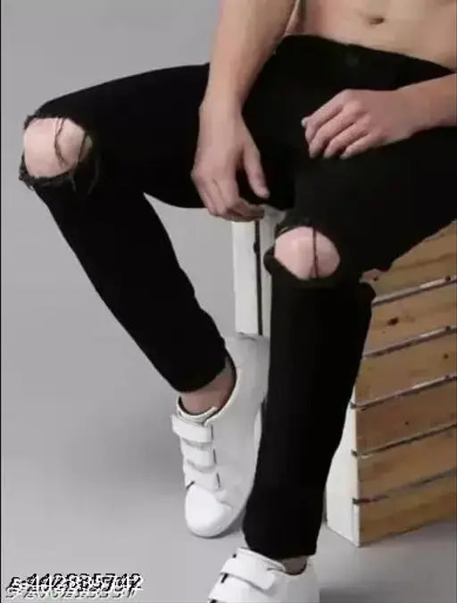 Black denim jeans with knee cuts, perfect for men's fashion