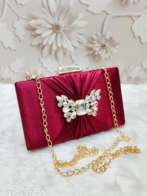 Red velvet clutch handbag for women, with a large sparkling brooch and gold chains