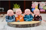 Resin monk Buddha figurines set (4 pieces), multicolor home decor item for positive energy