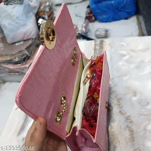 Pink snakeskin clutch with zip closure, multiple pockets and slots, suitable for women and girls