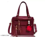 Maroon leather purse with tassel, silver hardware