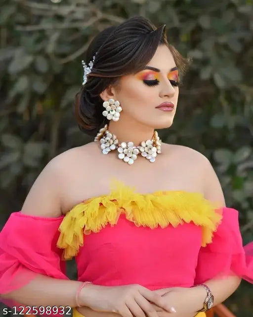 Designer net material multi-colored lehenga choli with yellow, orange, pink shades, semi-stitched and adorned with ruffles