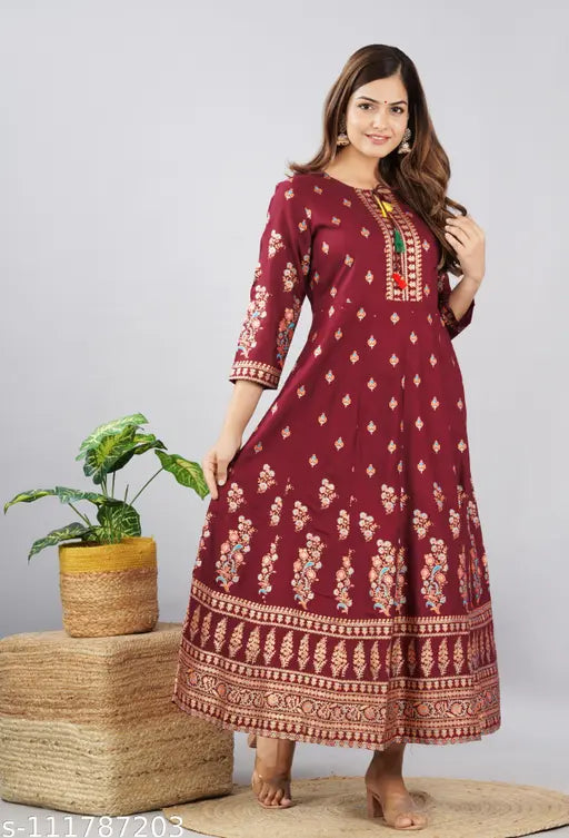 Red, floral patterned kameez with long sleeves and an embroidered waistband